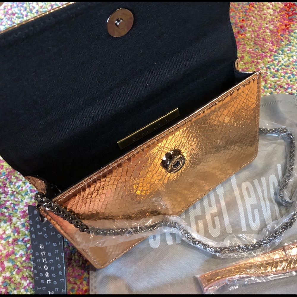 Rose gold snake skin textured clutch